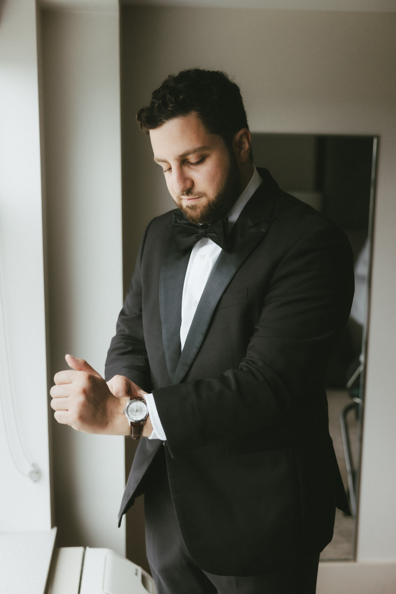 Groom getting dressed