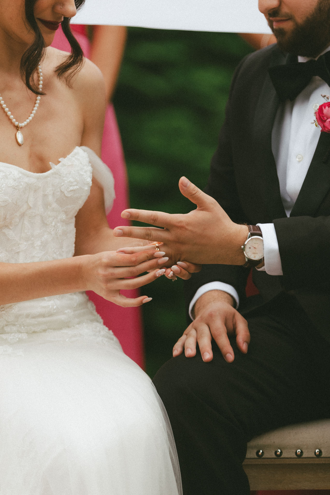 bride and groom exchange rings