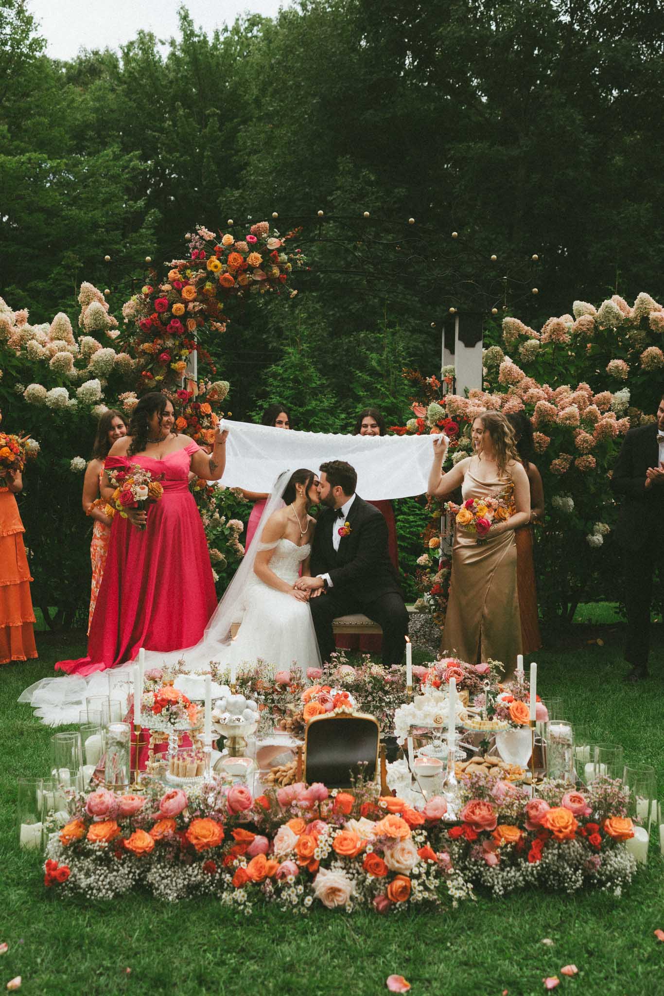 bride and groom kiss at Persian wedding ceremony