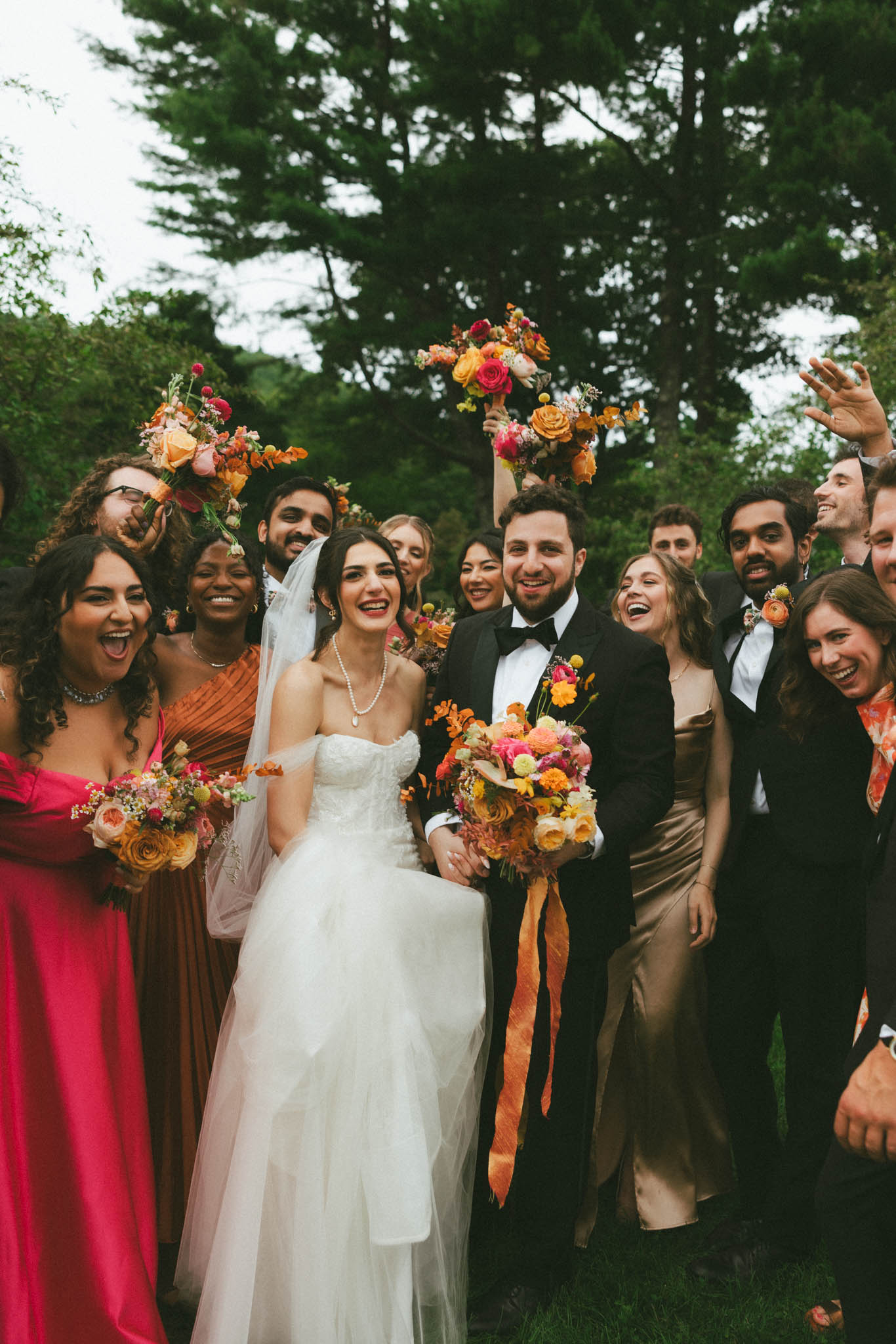 Bride groom and wedding party cheering