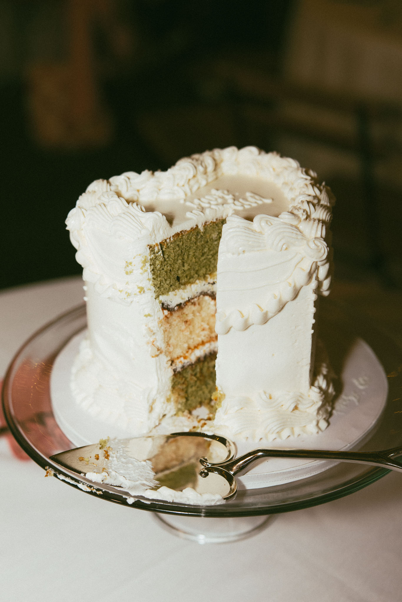 white heart shaped wedding cake cut open with layers