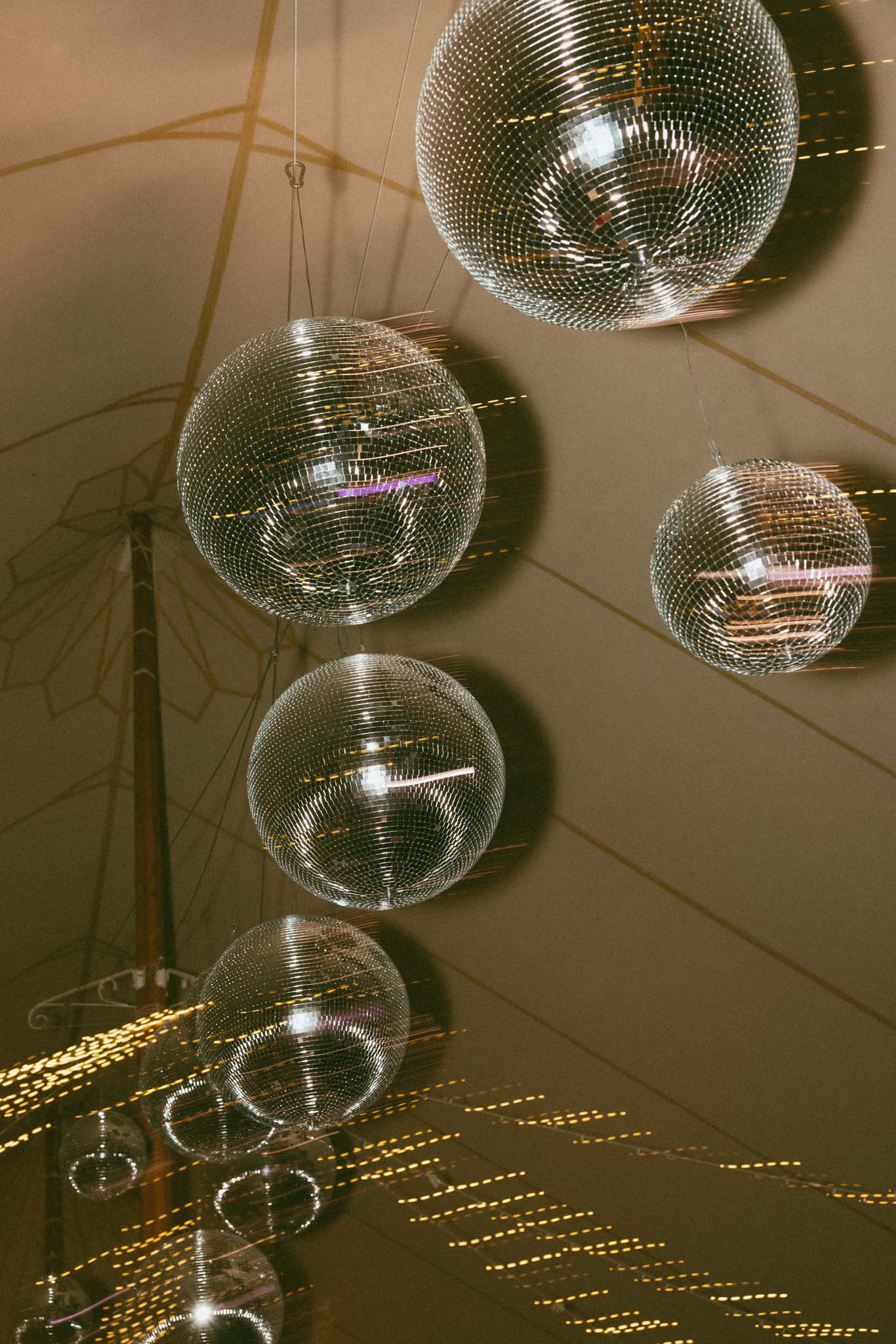 disco balls over wedding dance floor