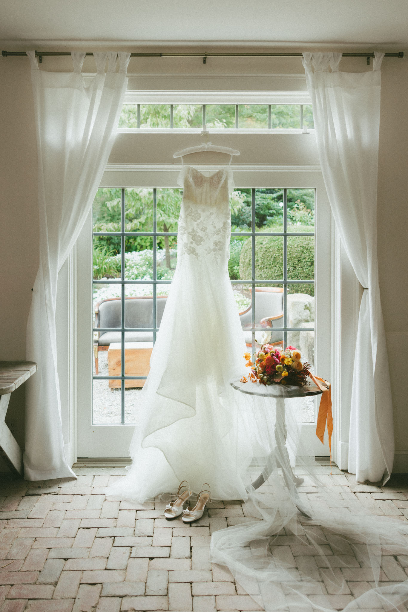 Wedding dress hanging in doorway