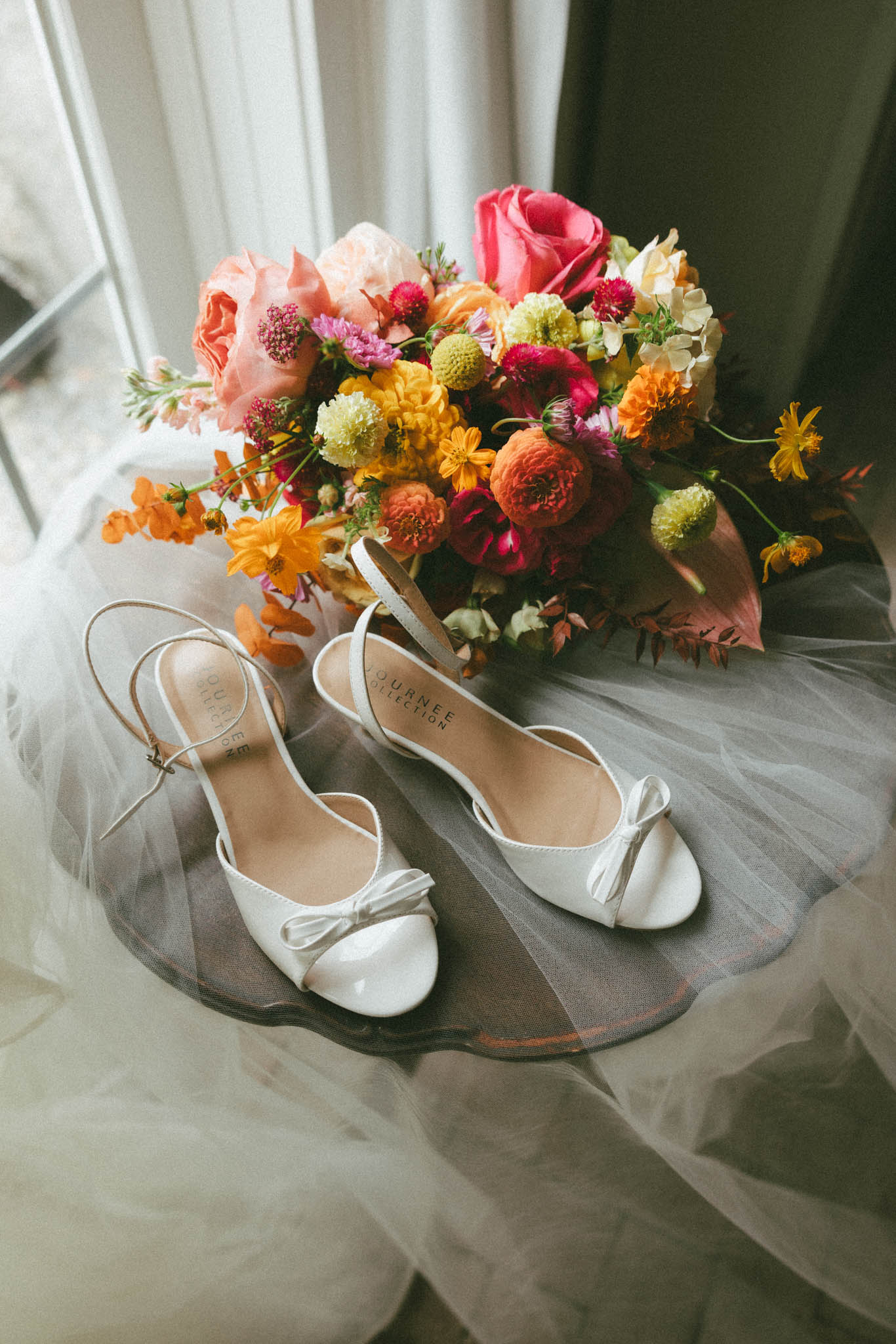 Wedding shoes and bright bridal bouquet