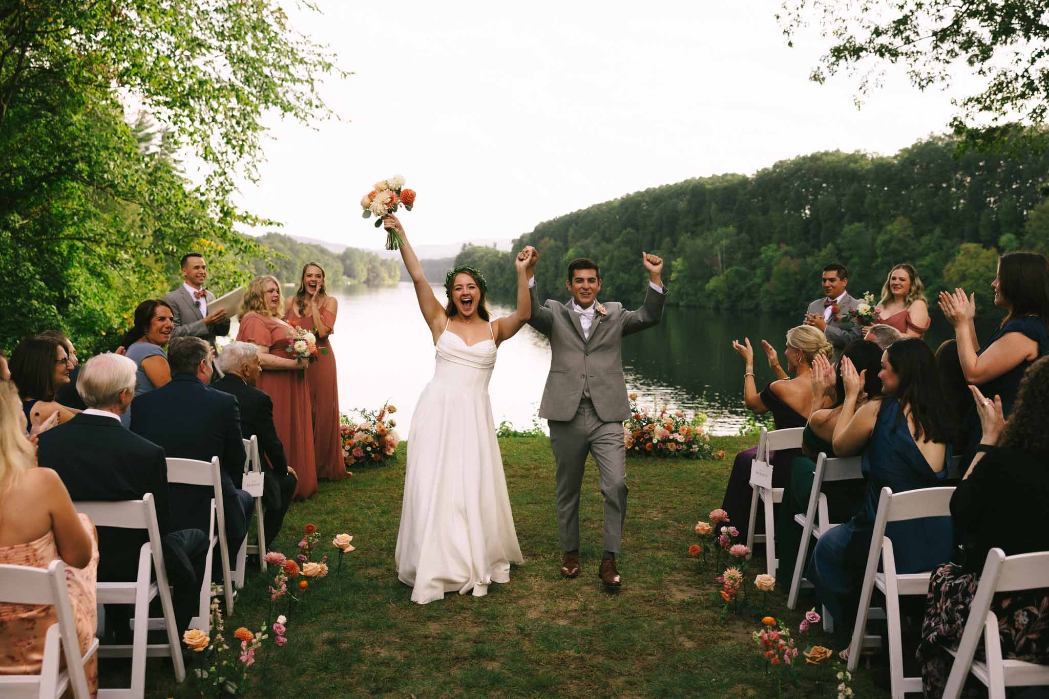 Bride and groom exit alter excitedly after just getting married.